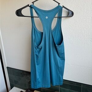 Lululemon Swiftly Tank. Never worn. Size 4. Hip length.